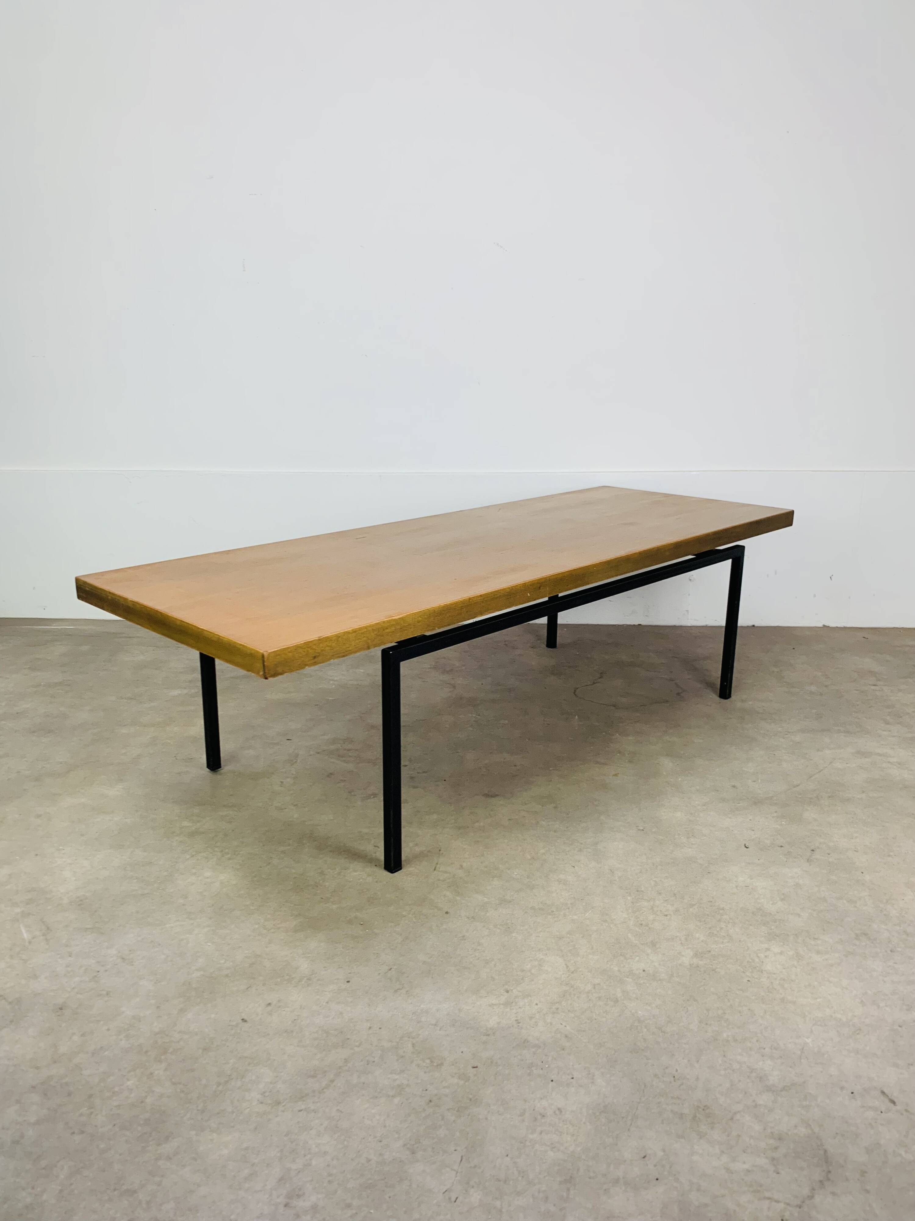 1950s modernist coffee table, wood and black metal.