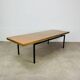 1950s modernist coffee table, wood and black metal.