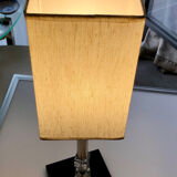 Silver floor lamp with a straight shade.