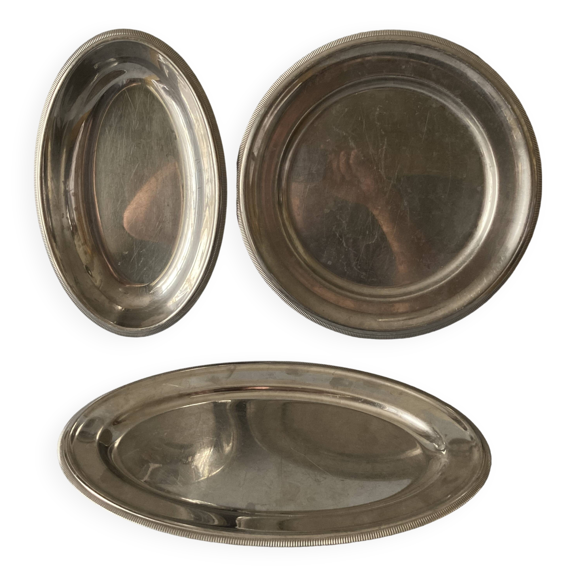 Set of three Letang & Remy stainless steel dishes.