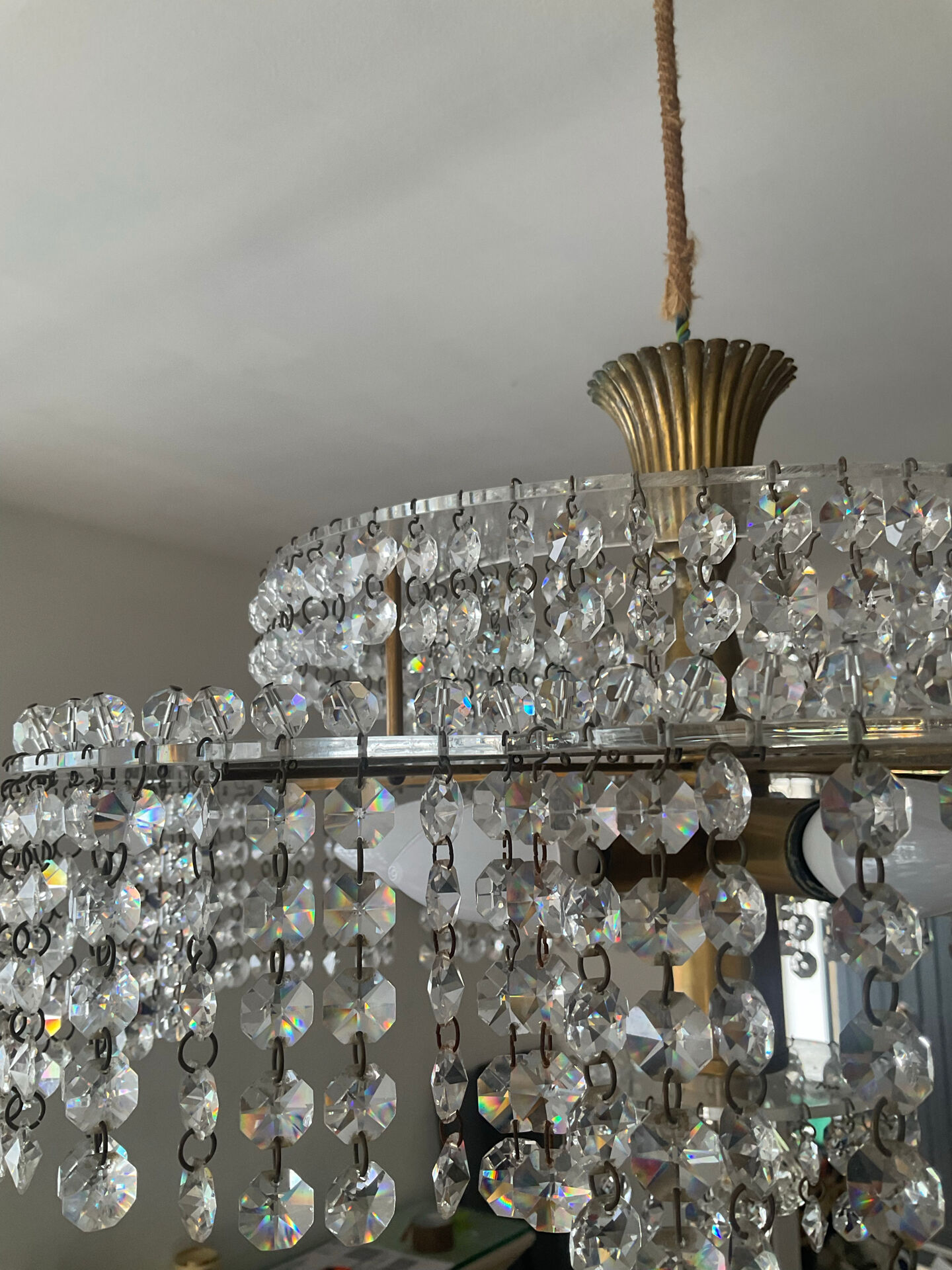 Vintage lucite chandelier with a cascade of crystal pendants from the 1970s.