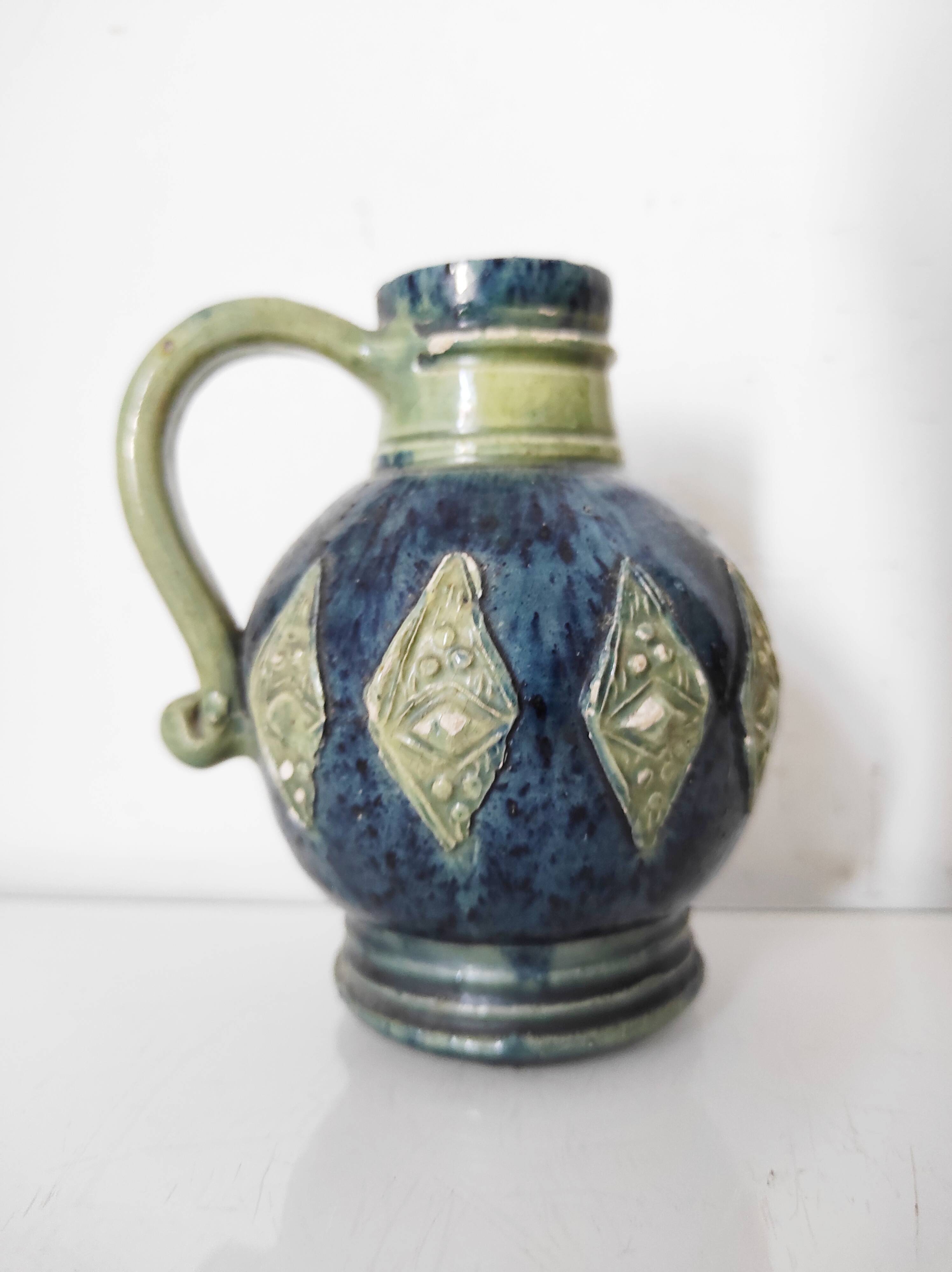 Two small blue ceramic vases