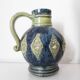 Two small blue ceramic vases