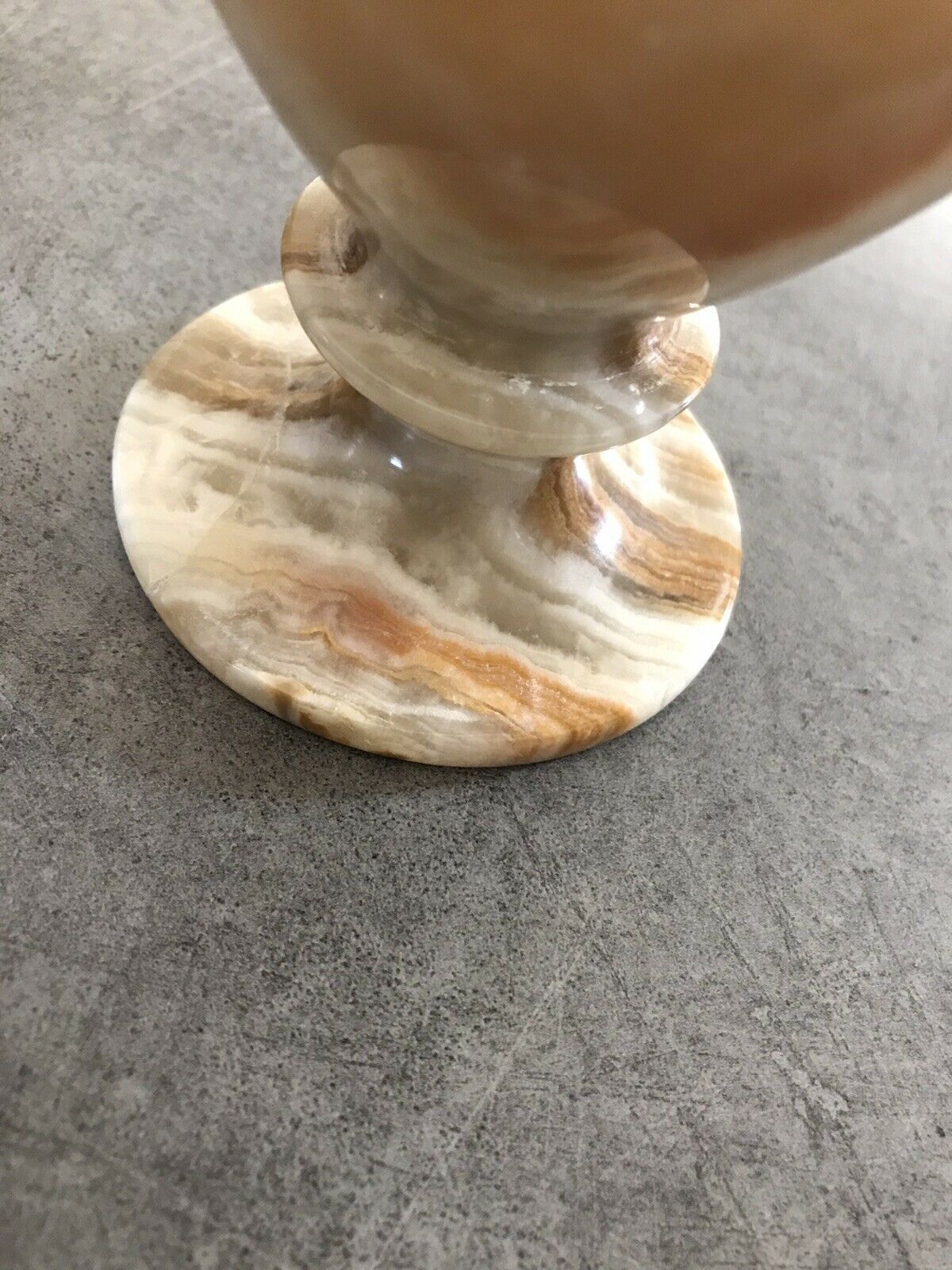 Vintage vase in marbled onyx stone shades of beige and brown