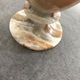 Vintage vase in marbled onyx stone shades of beige and brown