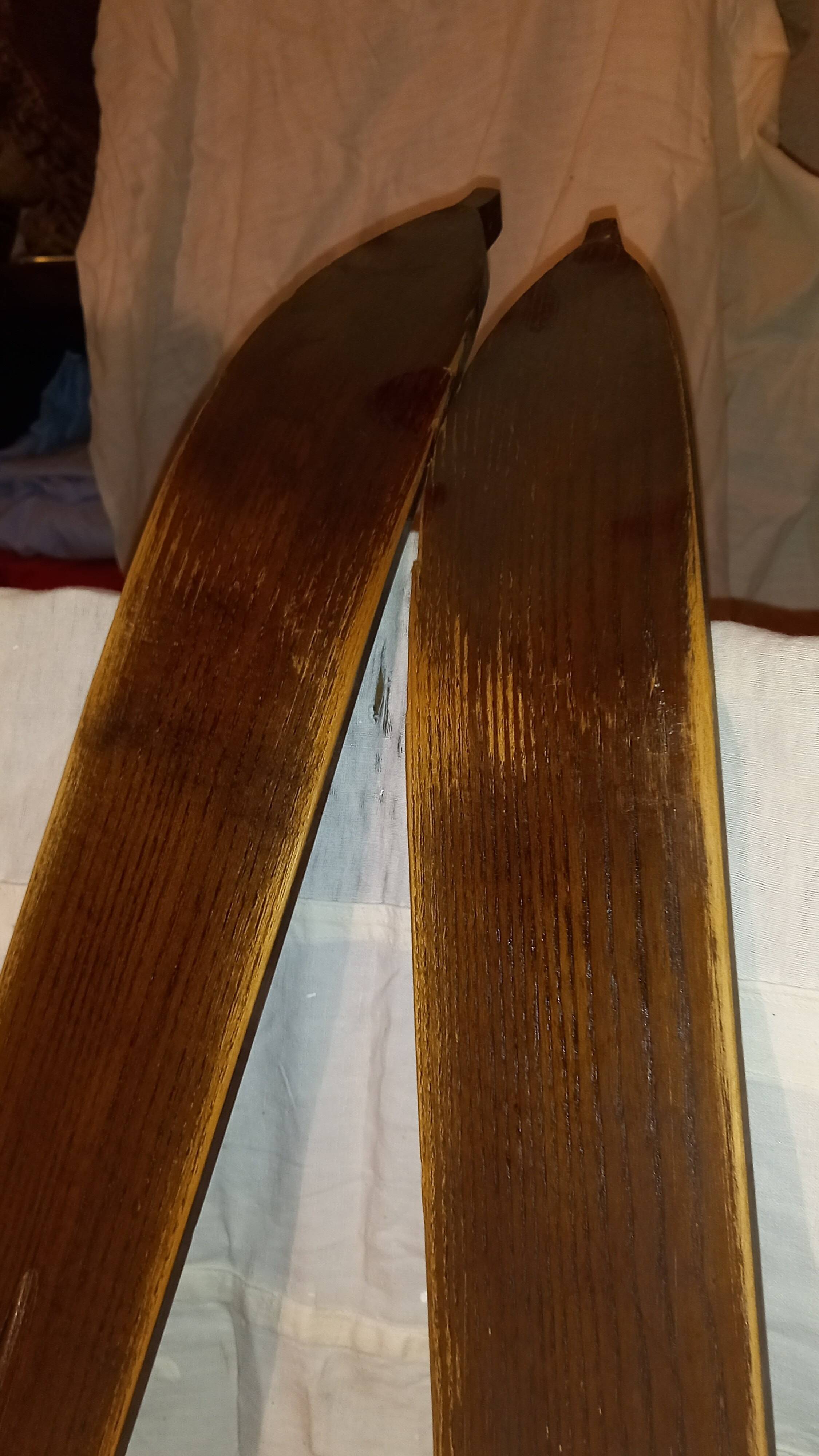 Pair of vintage wooden Skis and their poles + shoes.