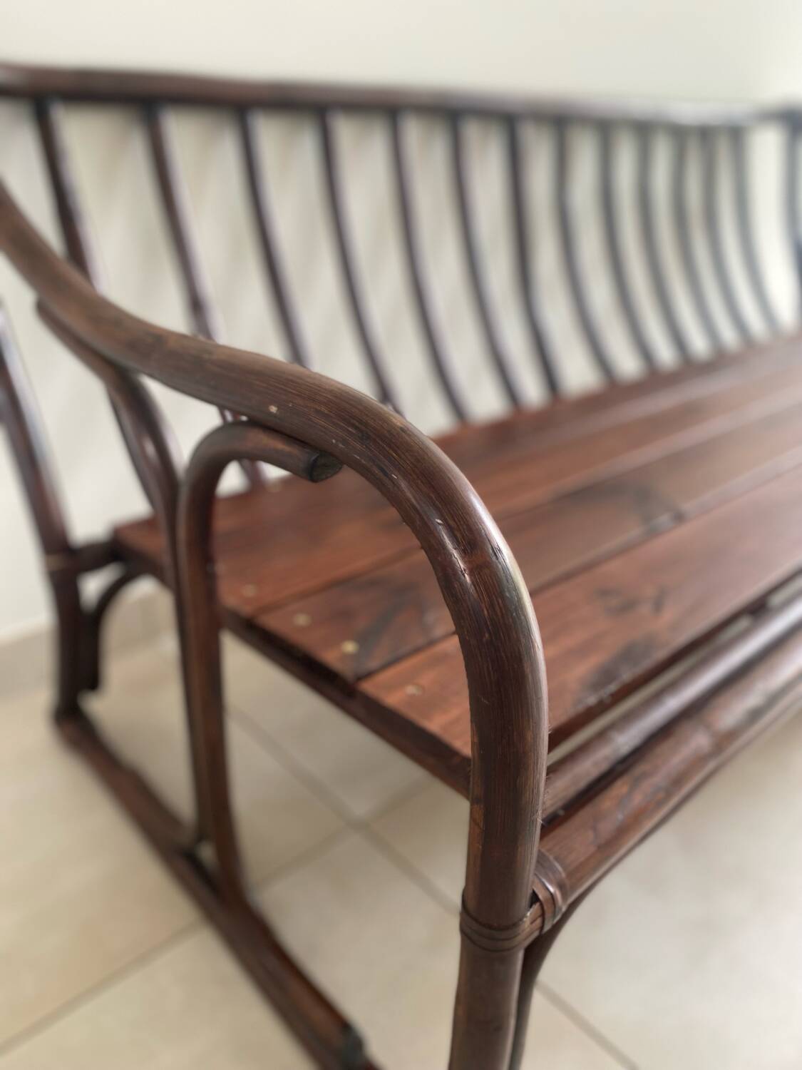 Vintage rattan bench from Maison Kok