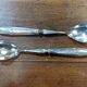Silver-plated salad cutlery in their case.
