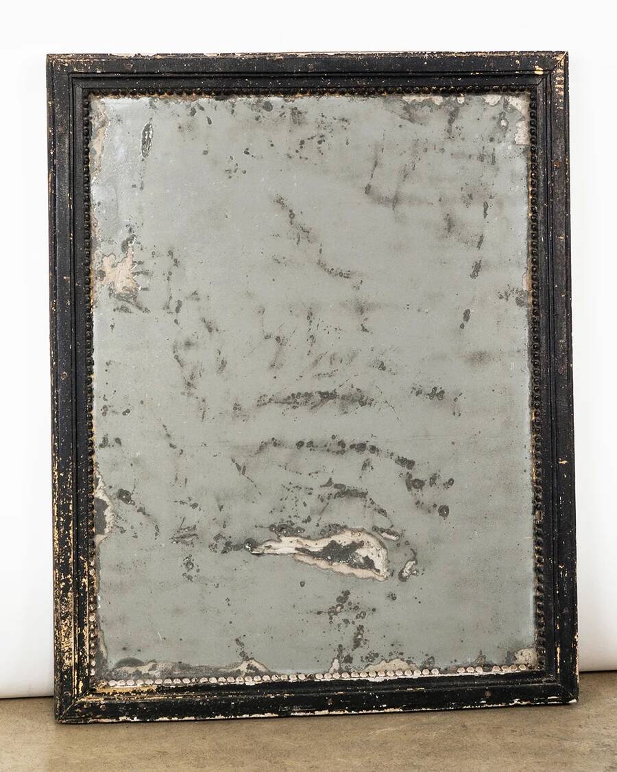 Antique French mirror from the late 19th century with a black painted frame.