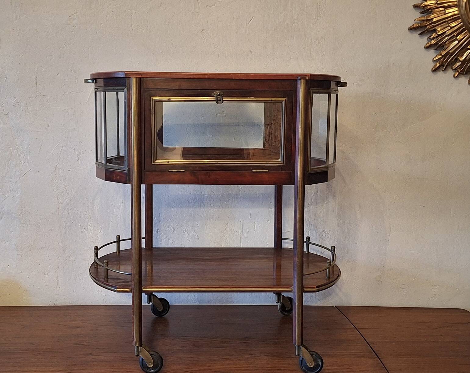 Art Deco service trolley in mahogany, brass, and glass, 1920.