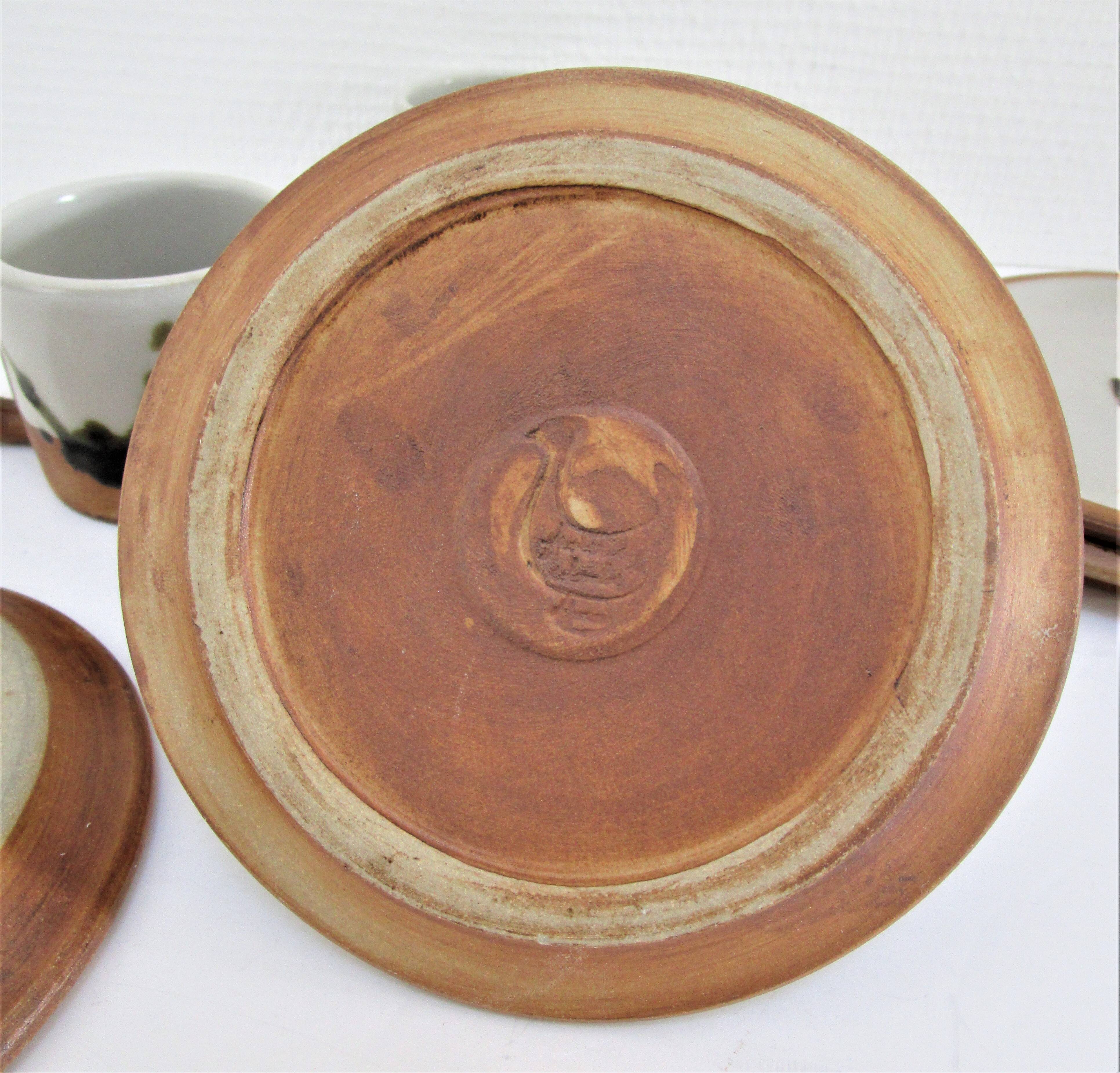 Four pottery cups and saucers from La Colombe Vallauris
