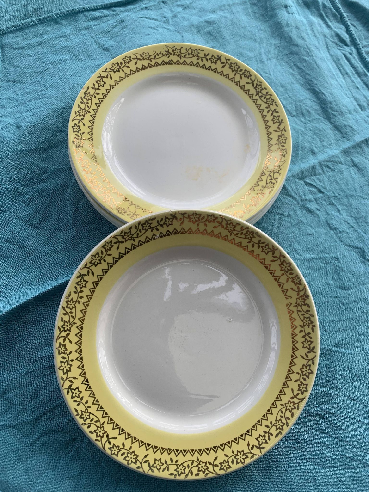 6 small plates with yellow borders and floral pattern gold antiques