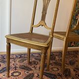 Pair of Louis XVI style fluted gilded chairs