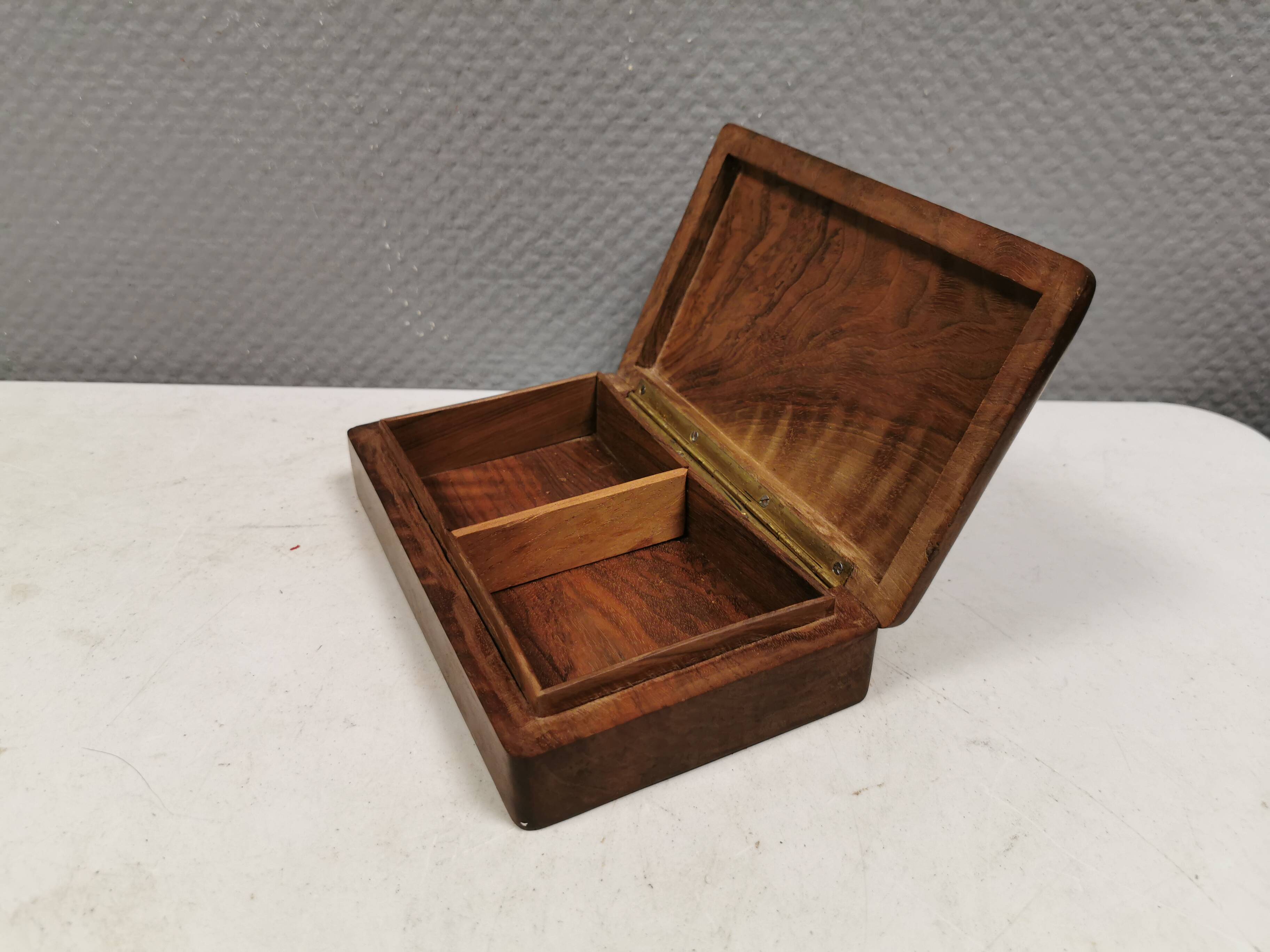 Wooden trinket box for storing jewellery, cigarettes or similar items.