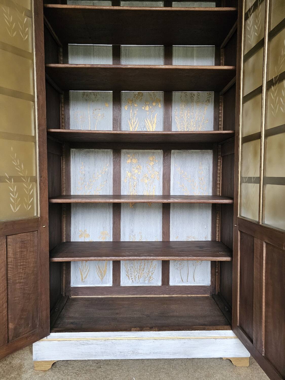 Antique bookcase with a white cerused patina