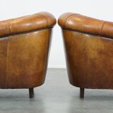 Set of 2 sheep leather club chairs in a cognac color