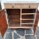 Vintage woven rattan furniture with tapered legs.