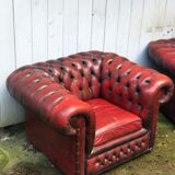 Pair of red leather chesterfield chairs