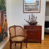 Cane seat armchair from the 19th century in the Louis XV style, known as "couillard".