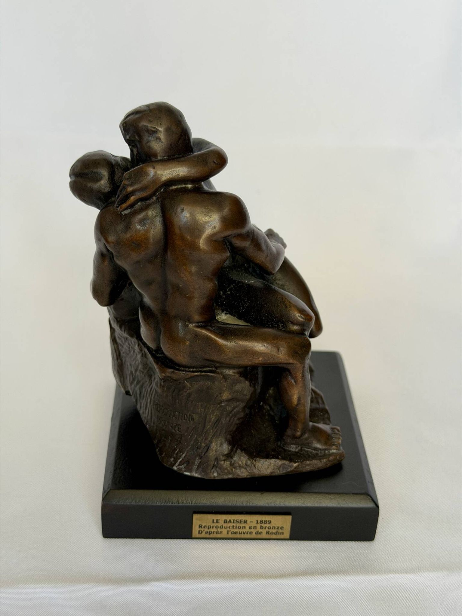 The bronze sculpture The Kiss, a reproduction of Rodin's statue, French sculpture.
