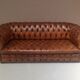 Upholstered chesterfield brown sofa