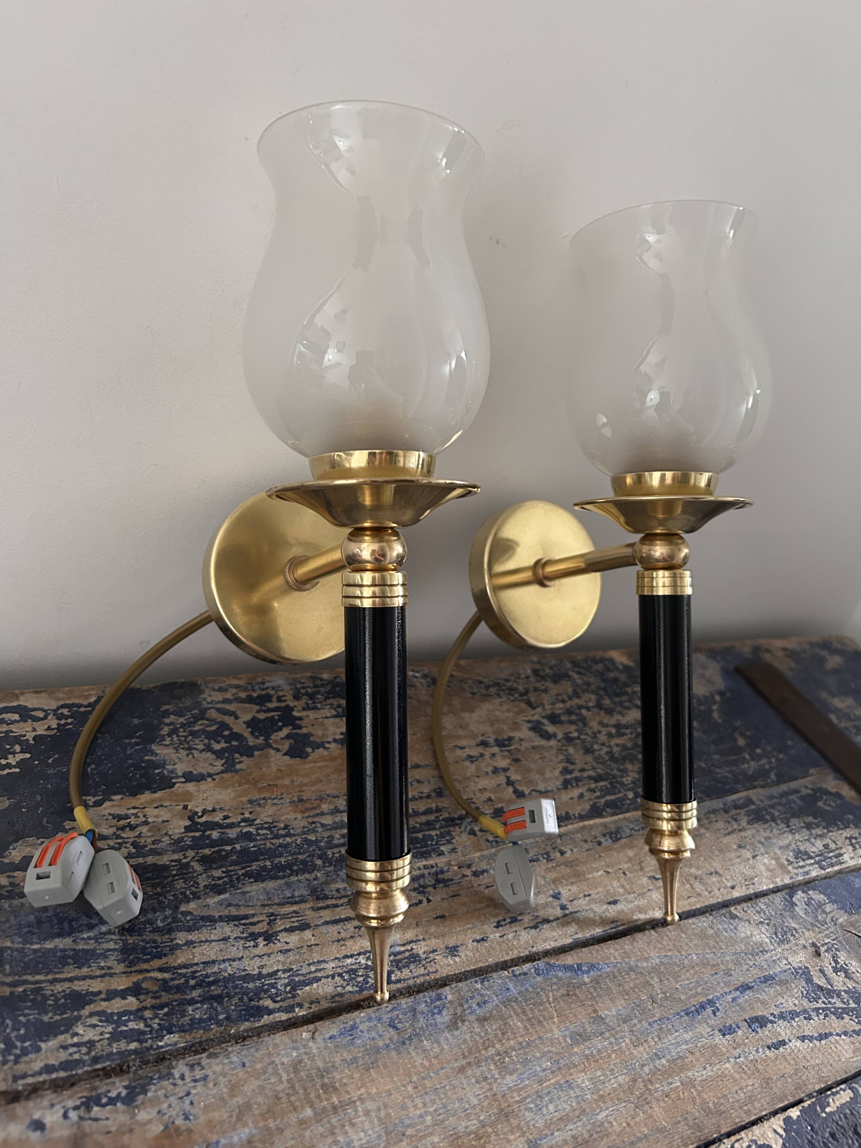 Pair of brass and black torchiere wall lights
