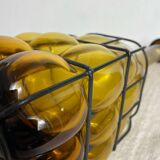 Glass carafe encased in wrought iron