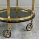 Rolling serving table in gold metal and smoked glass, 20th century