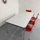 Large table design USM Haller with a white top and chrome structure.