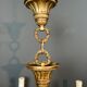 Bronze chandelier with ram's head motifs in the Louis XVI style, in the manner of Maison Jansen.