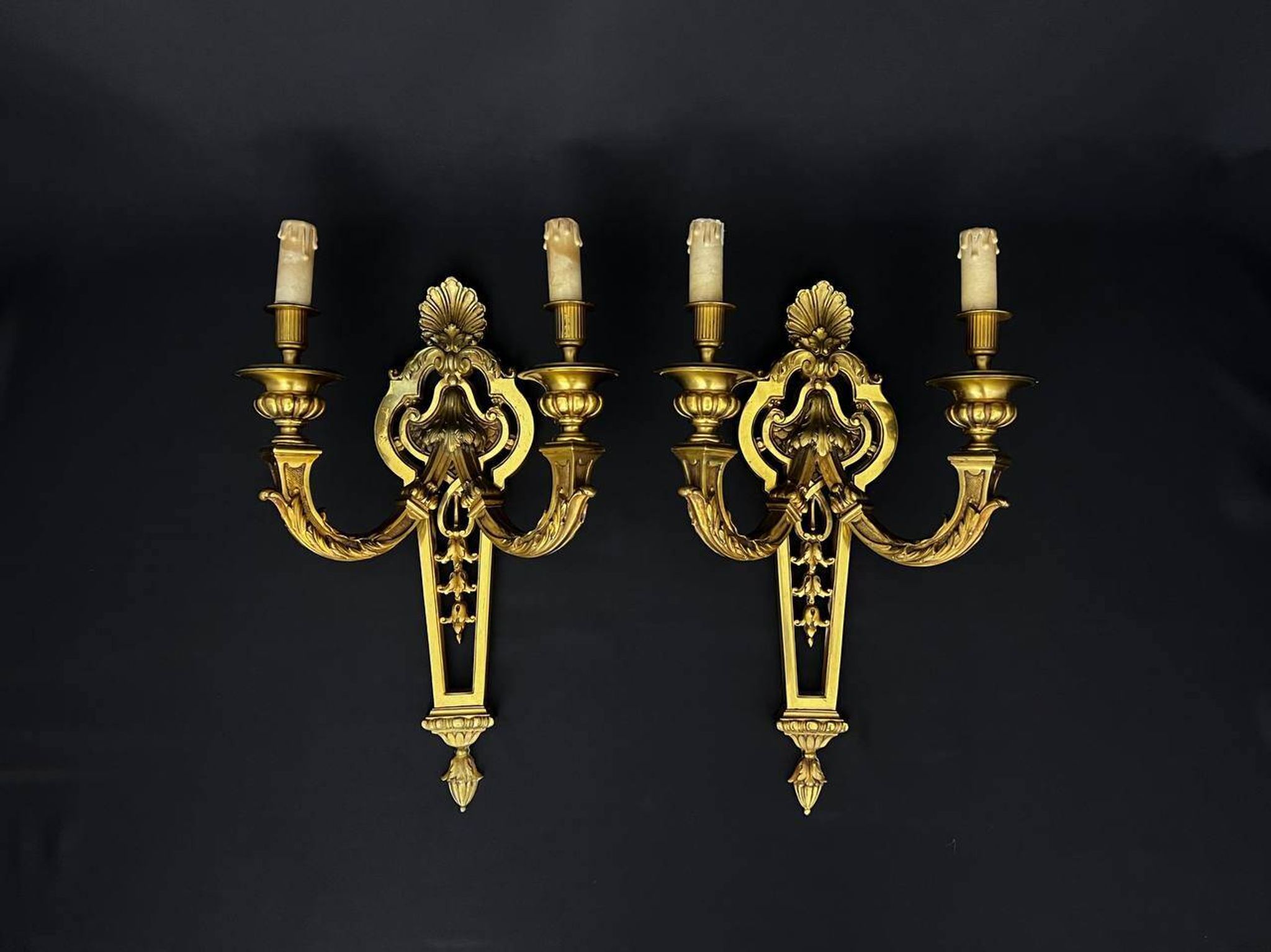Large pair of gilt bronze wall sconces in the Louis XVI style.