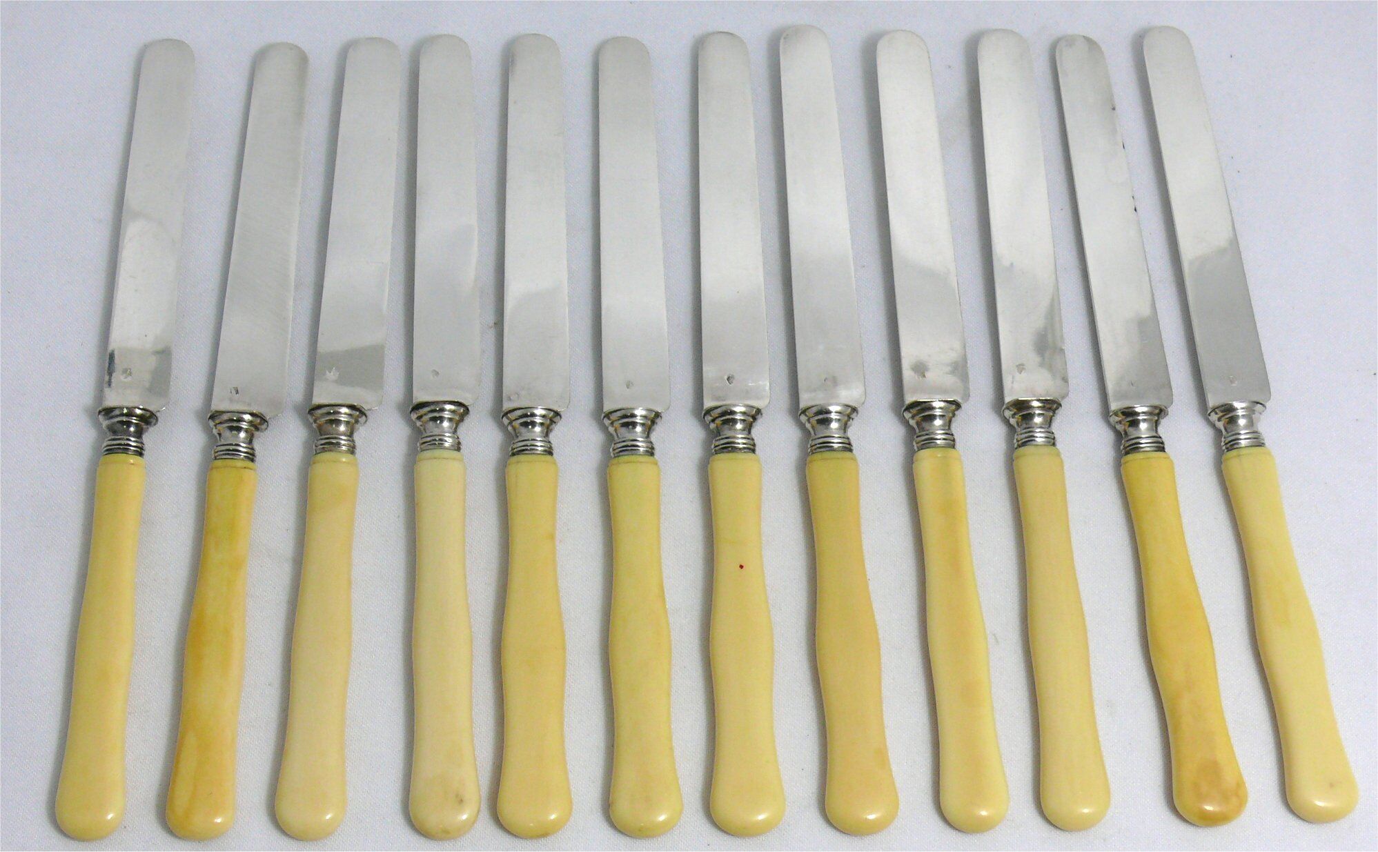 12 fruit knives, dessert knives, serving knives, engraved silver blades.