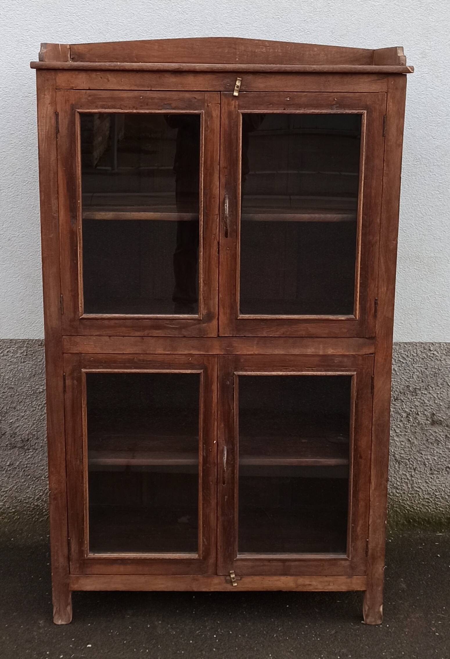 Old wooden glazed cabinet with four doors