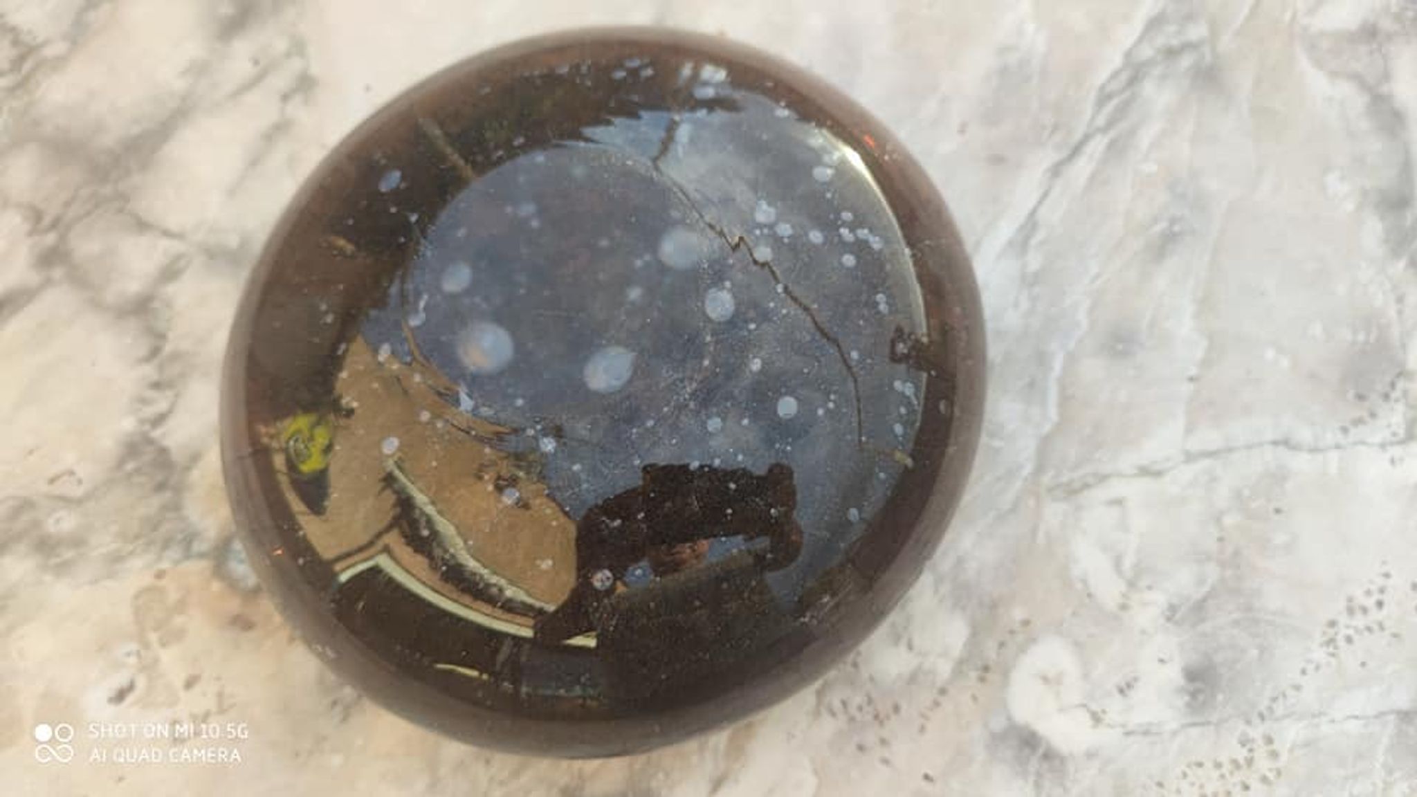 Flattened spherical vase made of glass paste