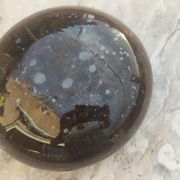 Flattened spherical vase made of glass paste