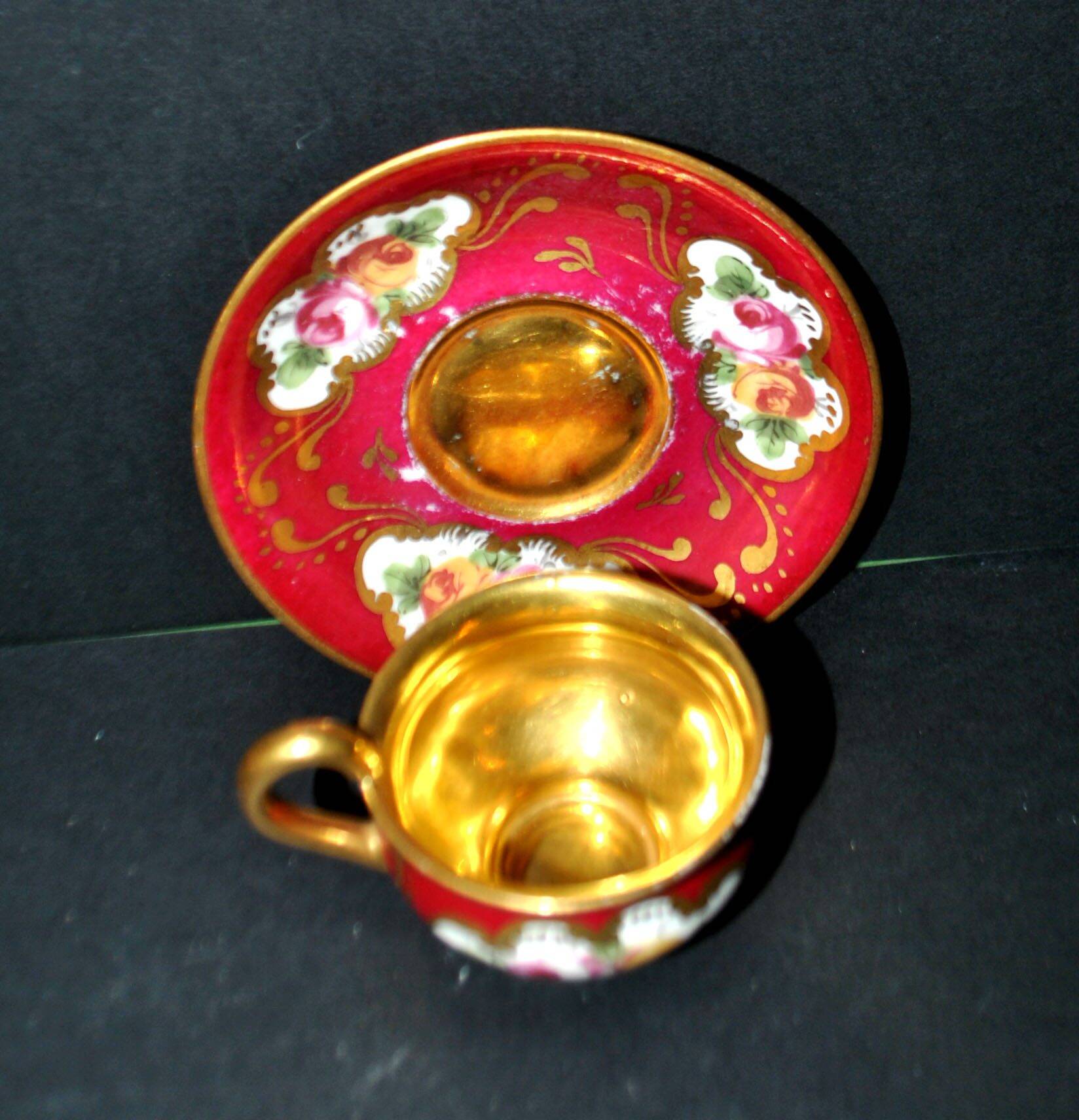 Limoges precious porcelain cup decorated in fuchsia pink and gold, signed MAB
