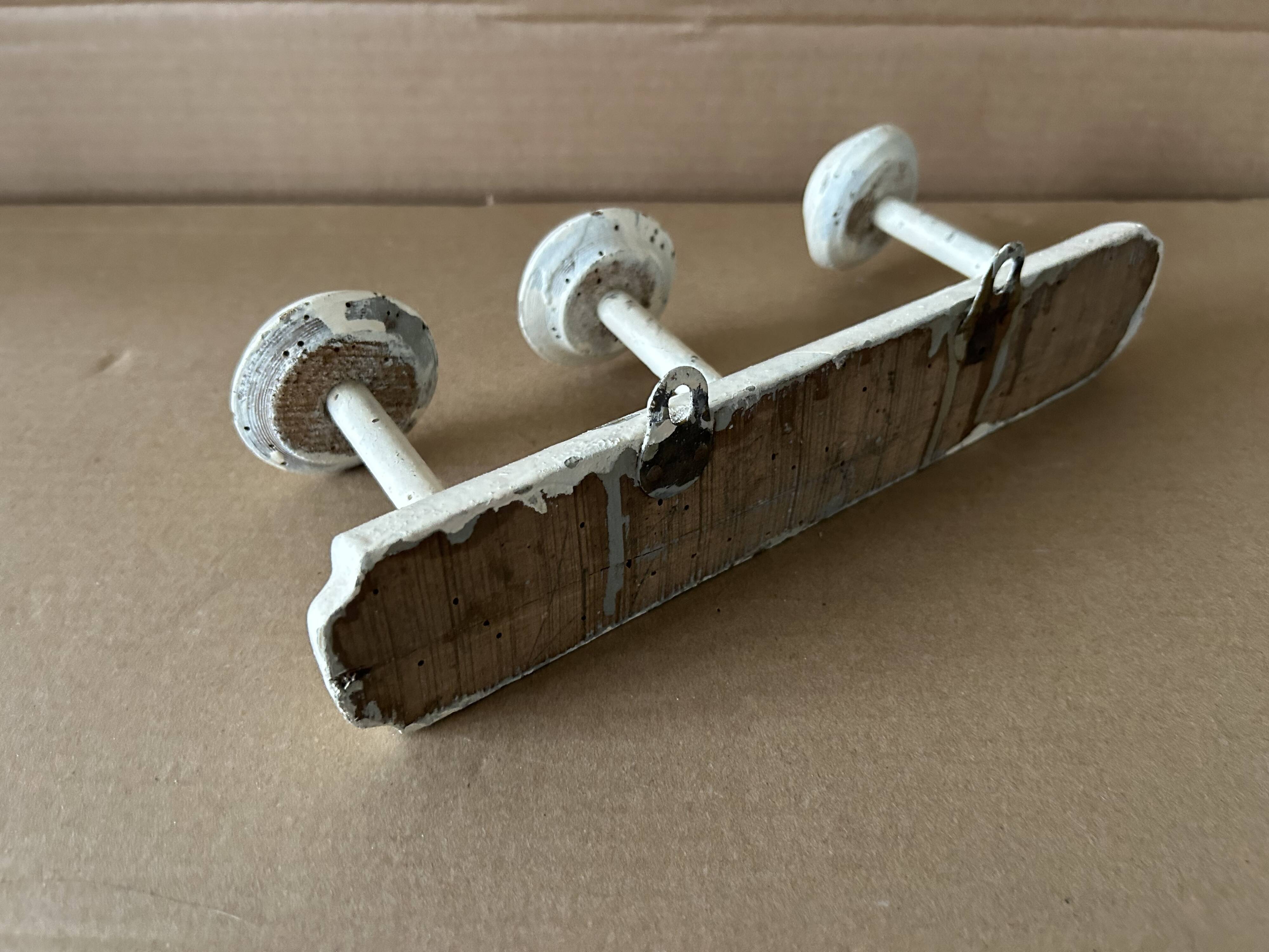 Antique wooden wall-mounted coat rack