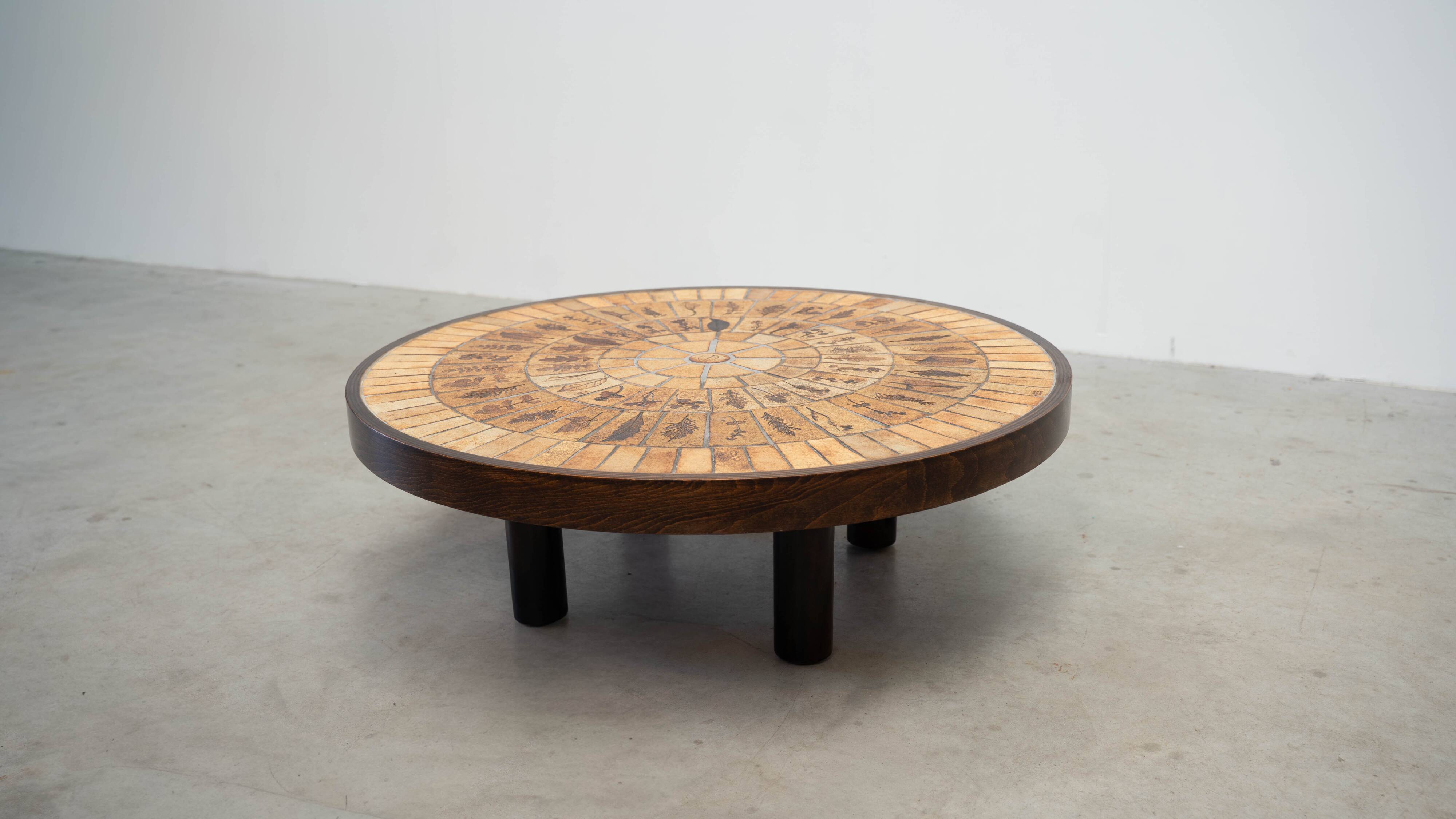 Round coffee table by Roger Capron