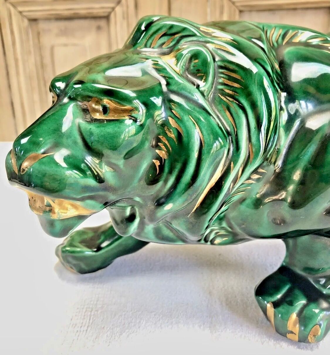 Art Deco lion statue cracked St Clement