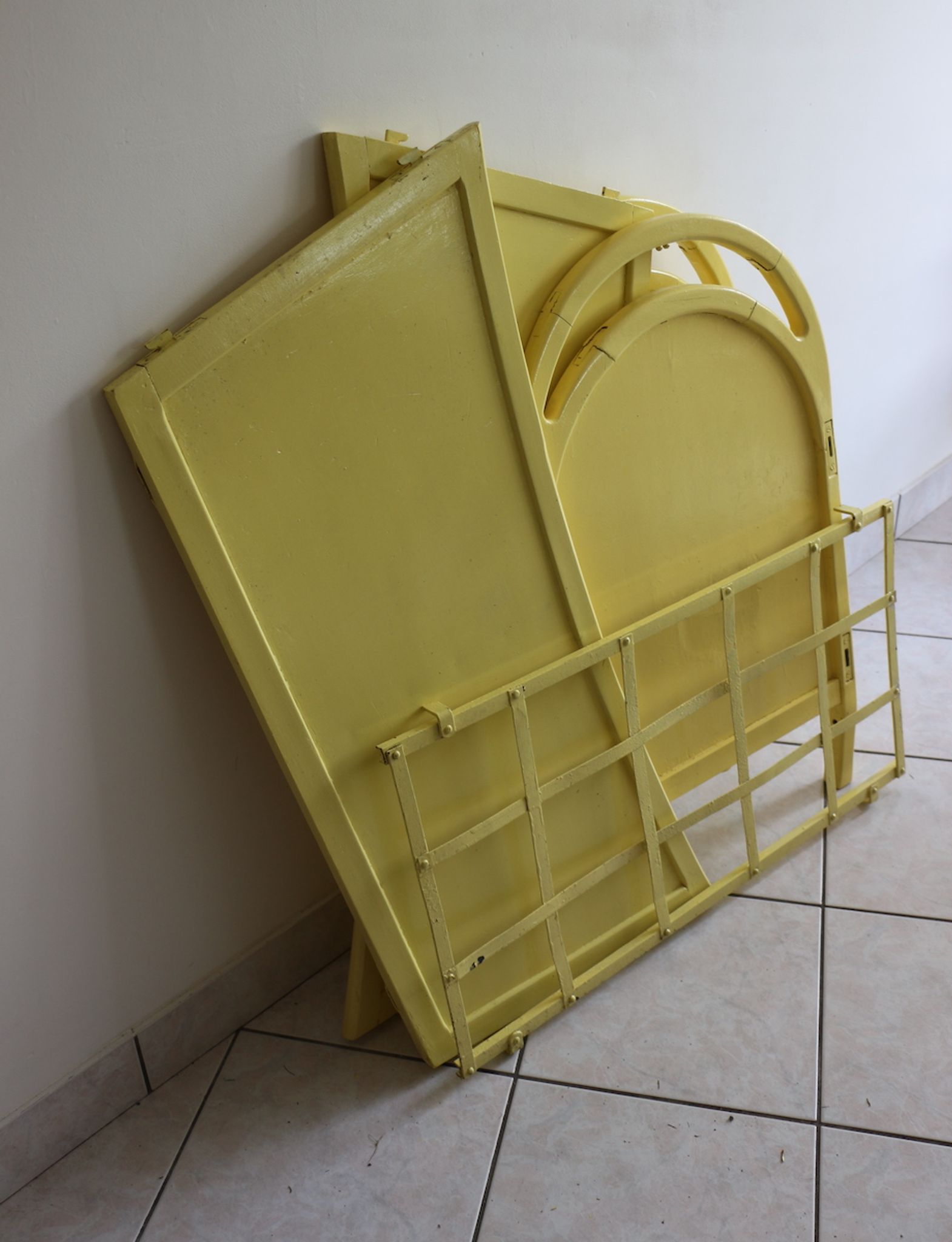 Yellow vintage baby cot