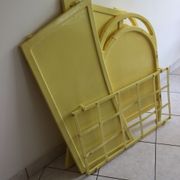 Yellow vintage baby cot