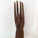 Carved wooden baguier hand