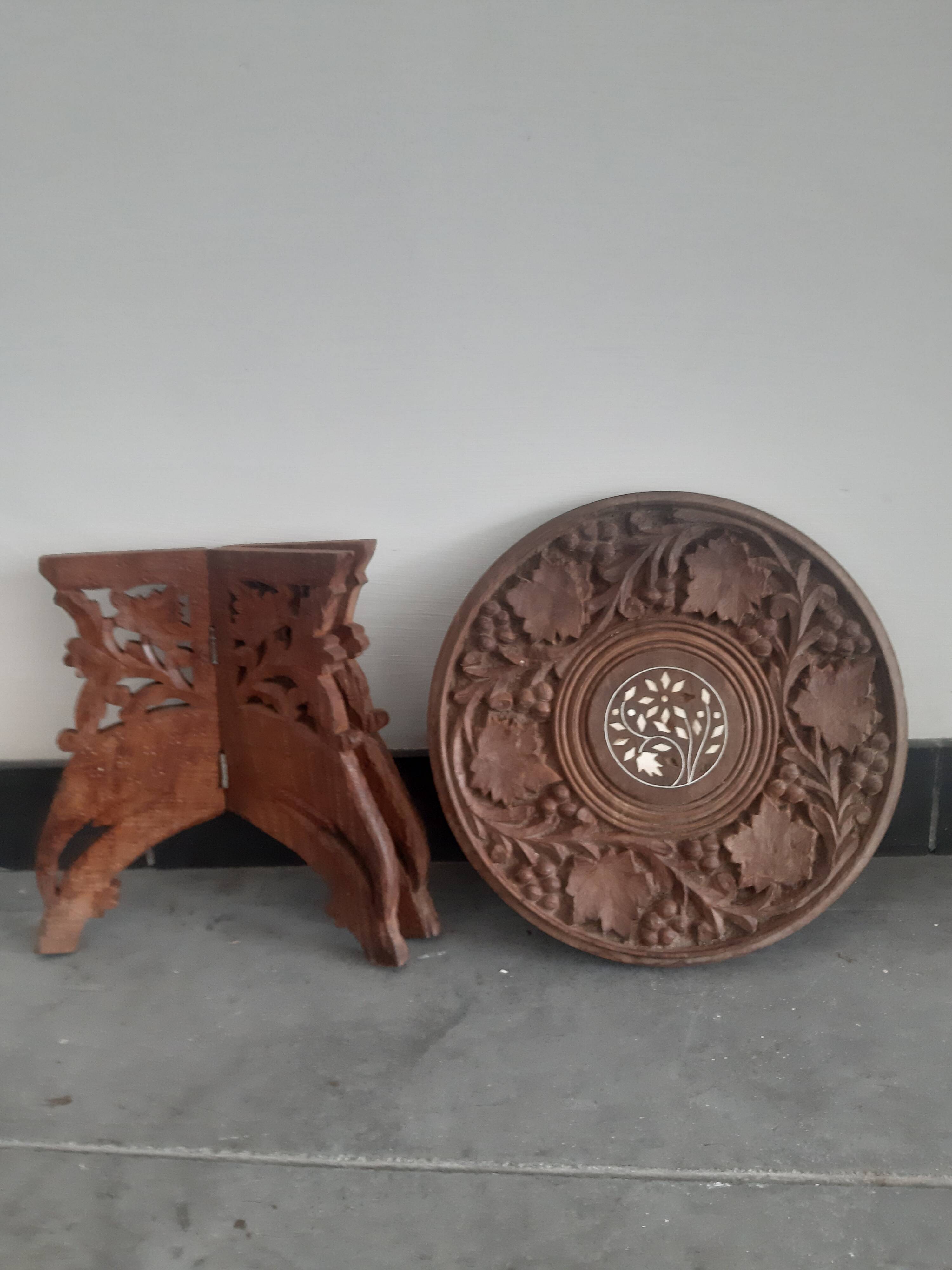 Carved wooden hunting stool decorated with vines