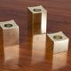 Group of cubic solid brass candlesticks by Gusum Metallslöjden, Sweden