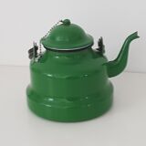 Old green kettle in enamelled metal