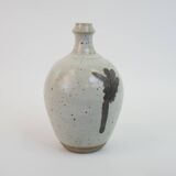 Stoneware bottle with abstract plant motif signed Herbes Folles