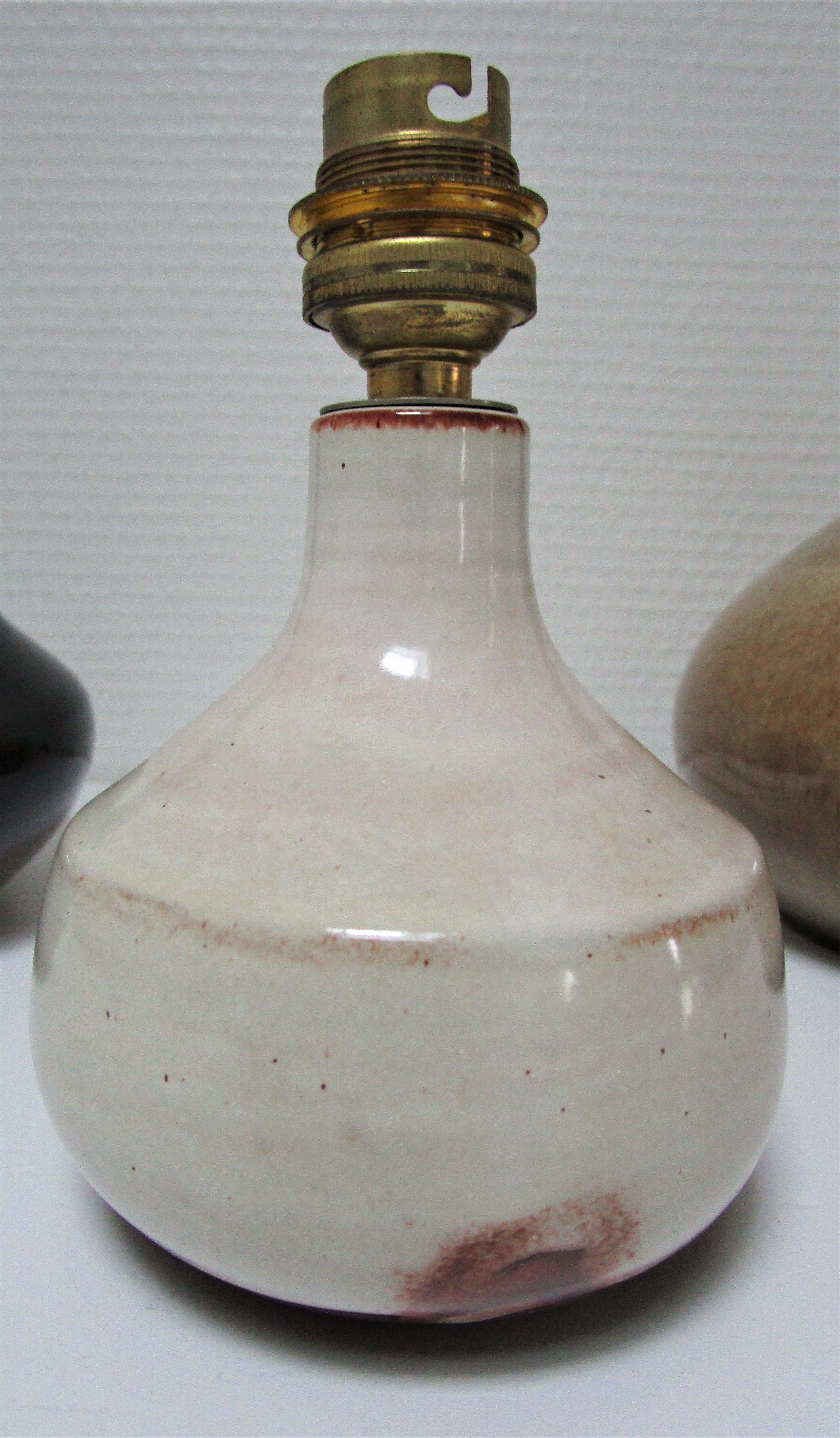 Three vintage ceramic lamps in blue, white and suede