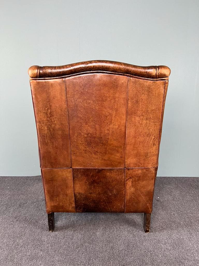 Vintage armchair in patinated sheep leather