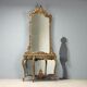 Ancient baroque console with a wooden mirror, Italy, late 19th century.