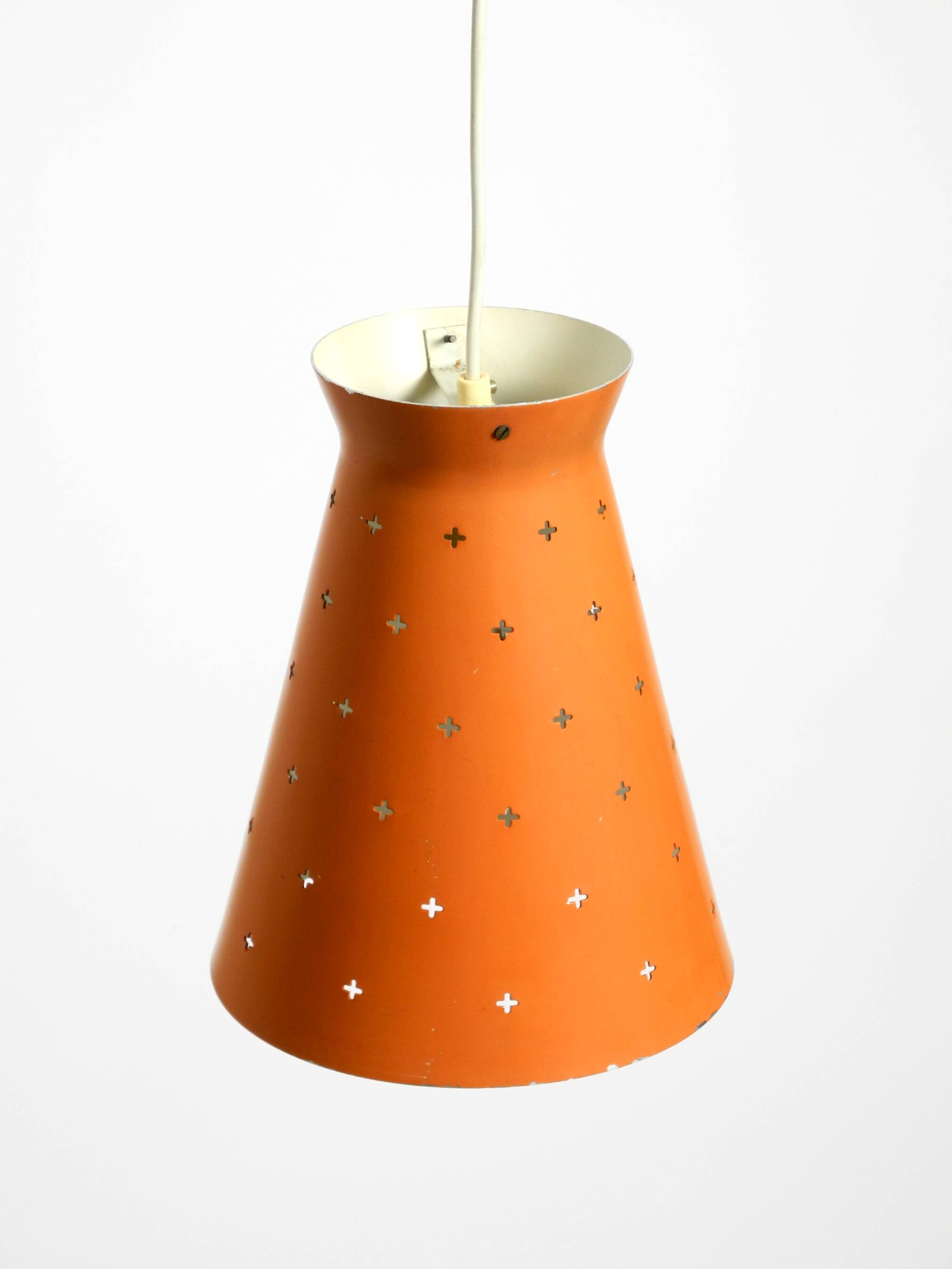 Beautiful Mid Century Modern Diabolo perforated metal sheet pendant lamp